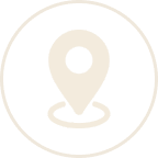 A beige location pin icon is centered within a thin circular border on a white background.